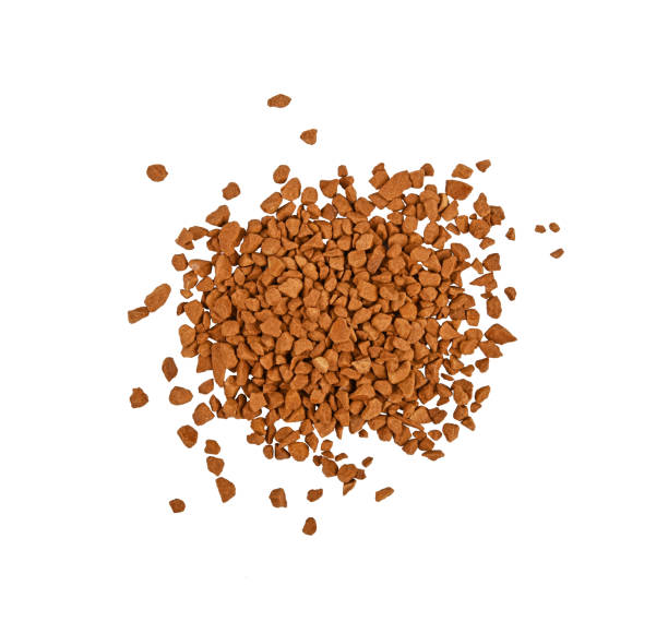 Heap of freeze dried instant coffee isolated Close up heap of freeze dried instant coffee granules isolated on white background, elevated top view, directly above instant coffee stock pictures, royalty-free photos & images