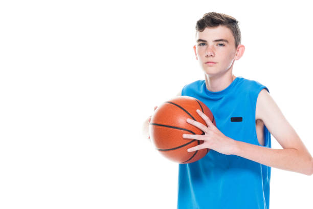 istock 13 year old male basketball player 1171183485