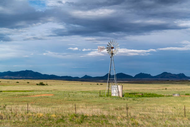 Windmill and storm clouds over the Sonoita Grasslands, Arizona.