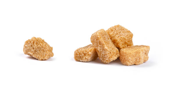 istock Close up brown sugar cubes isolated on white 1171183945