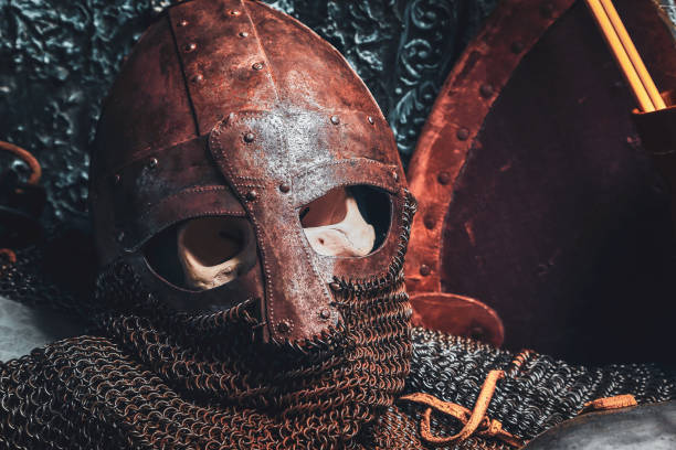 istock Ols rusted ancient helmet with human skull 1171184604