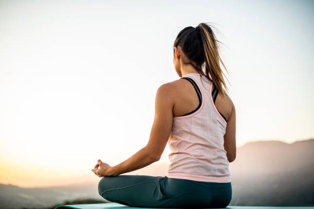 istock Young Hispanic Woman Meditating In The Mountains 1171184682