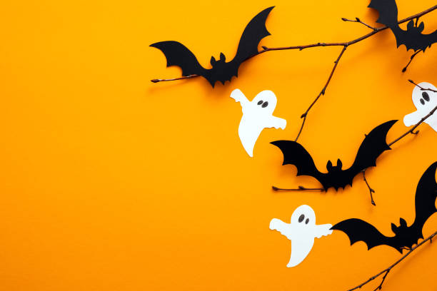 istock Happy Halloween day concept. Halloween decorations, paper ghosts, bats on orange background. Flat lay, top view, copy space. 1171184726