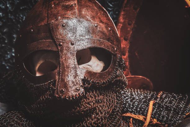 istock Ols rusted ancient helmet with human skull 1171184753