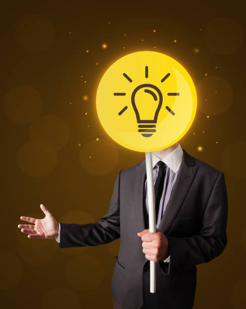 istock Businessman holding lightbulb sign 1171185390