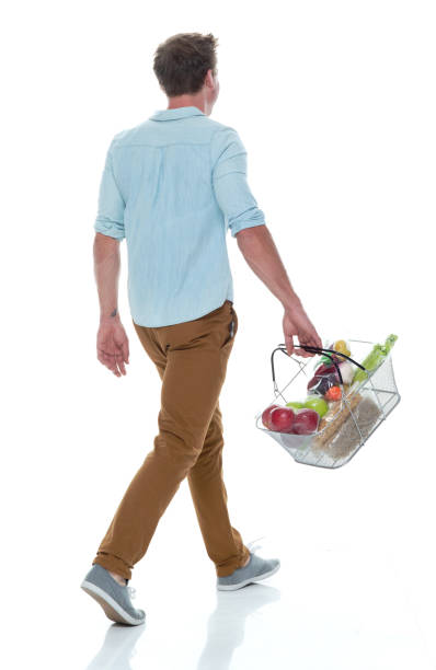 istock Handsome male holding shopping basket with vegetables 1171186647