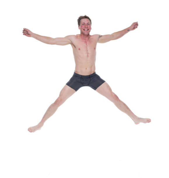 istock Handsome man wearing black underwear and jumping 1171187598