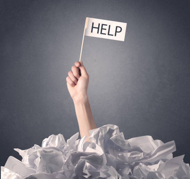 istock Female hand holding help sign 1171188904