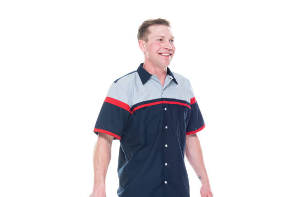 istock Young handsome male mechanic standing on white background - hands by side 1171190093