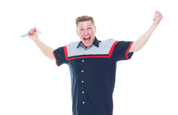 istock Young attractive male mechanic standing on white background - surprised 1171190284