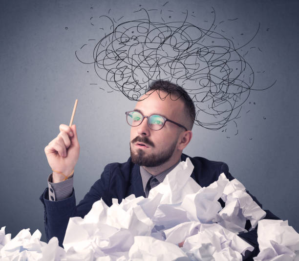 istock Businessman above crumpled paper 1171190310