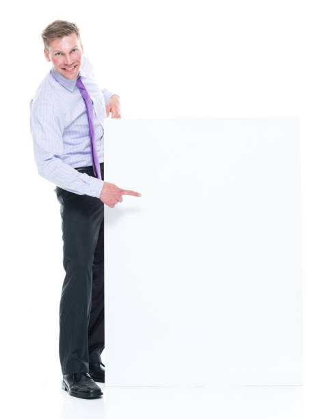 istock Young attractive businessman on white background - pointing 1171190589