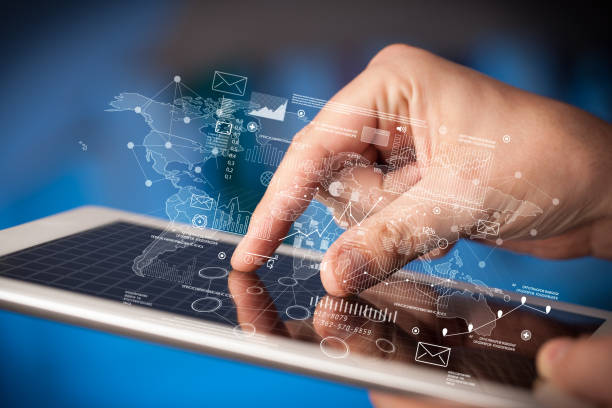 istock Fingers touching tablet with charts 1171191766
