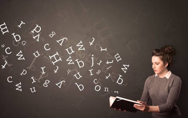 istock Young lady holding book with letters 1171191920