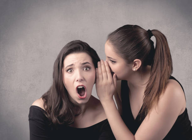 istock girl telling secret things to her girlfriend 1171193908