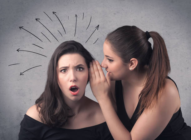 istock girl telling secret things to her girlfriend 1171193929