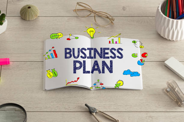 istock Notebook on the floor with office tools nearby 1171196188