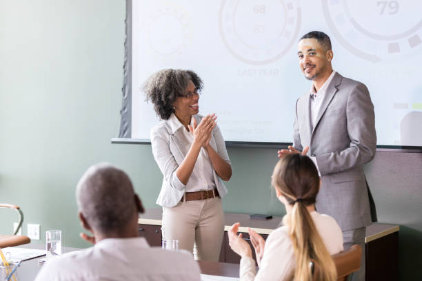 istock Businesswoman introduces guest speaker 1171196520
