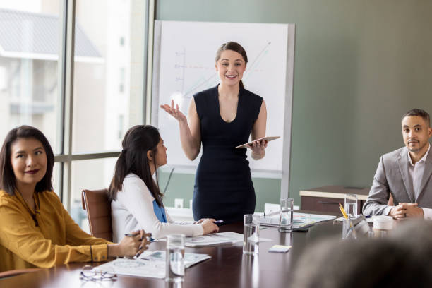 istock Confident young businesswomen gives presentation 1171196529
