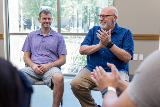 istock Support group applauds mid adult veteran 1171197445