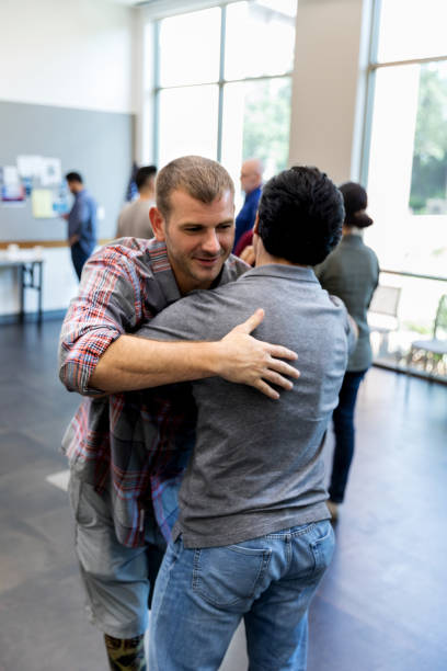 istock Brothers in arms greet each other with hug before meeting 1171197626