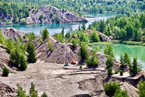 istock camping on the turquoise lake shore among mountains 1171198627