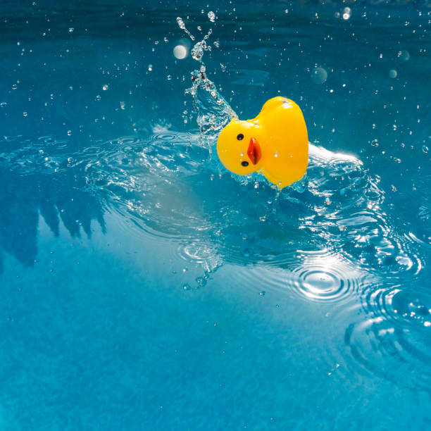 istock Yellow rubber ducky plunging into water 1171198685