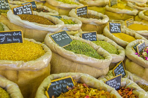 Produce market with spice in the town of Apt in Provence, France