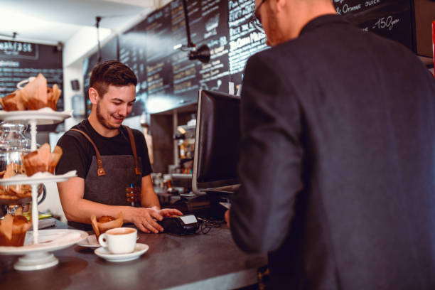 istock Customer And Barmen Happy To Conduct The Fund Transaction 1171200800