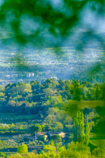Town of Bonnieux with a view of the agricultural countryside in Provence, France