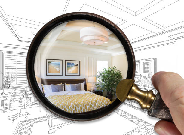 istock Hand Holding Magnifying Glass Revealing Finished Master Bedroom Over Drawing 1171204802