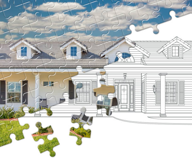 puzzle pieces fitting together revealing finished house build over drawing - custom built imagens e fotografias de stock
