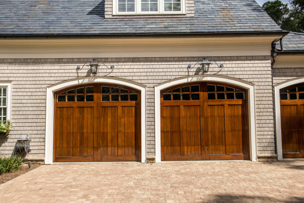 istock Stained wood custom garage doors for large southern home 1171207238
