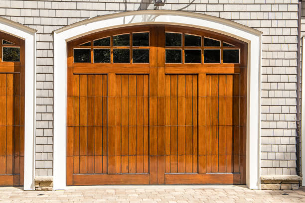 istock Stained wood custom garage doors for large southern home 1171207278