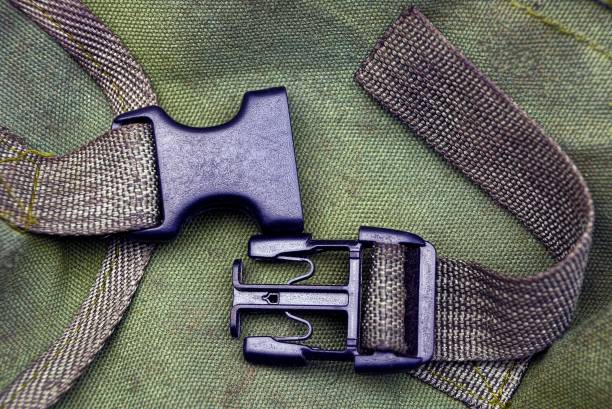istock black open plastic carabiner on green harnesses on the fabric 1171207297