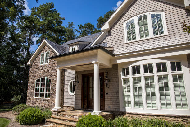 istock close up of gray wood shingle cape cod style home with columns and windows 1171207349