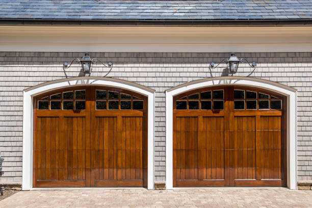 istock Stained wood custom garage doors for large southern home 1171207388