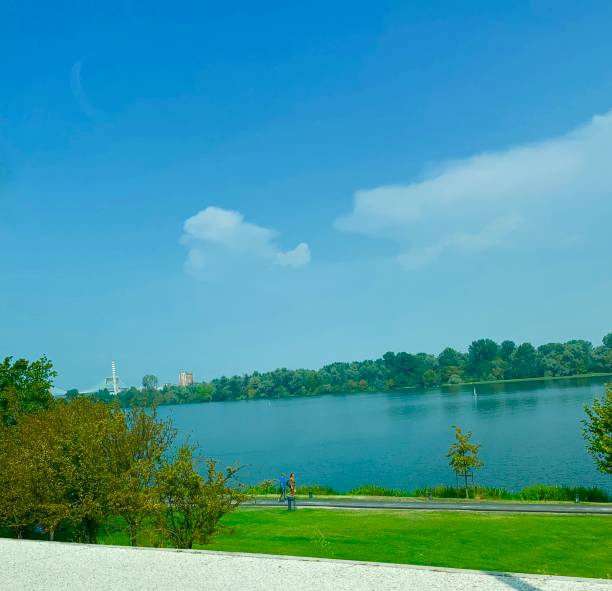 istock Beautiful lake side view with green grass 1171209854