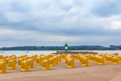 Hooded beach chairs (strandkorb) at Baltic seacoast in Travemunde, Germany