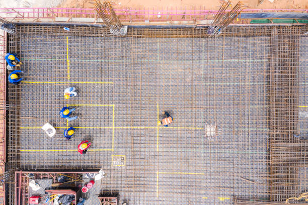 istock Aerial view of group of construction worker building in construction site. 1171215975