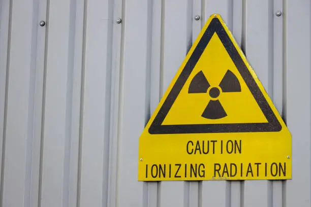 Photo of Caution ionizing radiation sign on the wall