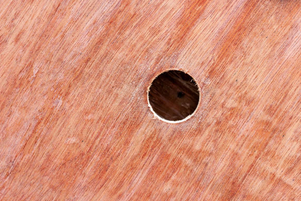 istock Hole in a packing crate plywood side 1171218936