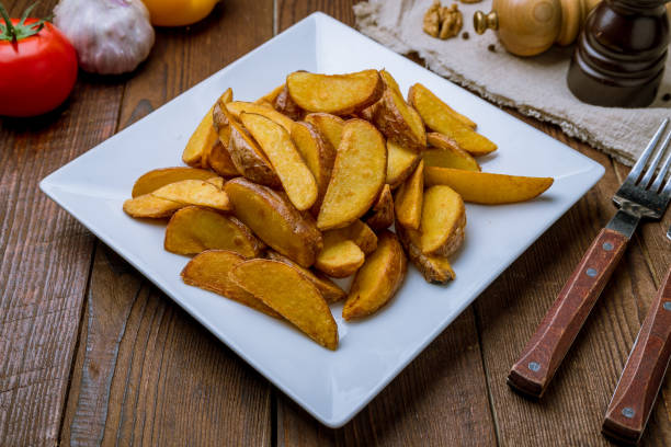istock The potatoes wedges on wooden table 1171219011