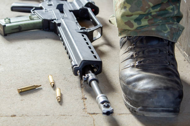 A man takes aim with a riffle.