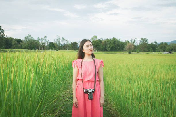 istock Asian woman's portrait in the meadow. 1171233312