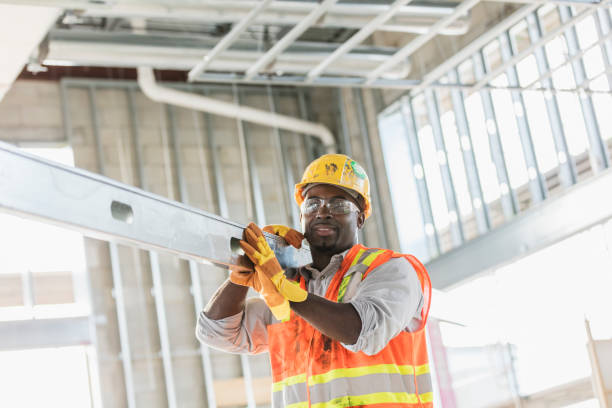 istock African-American construction worker carrying metal beam 1171239025