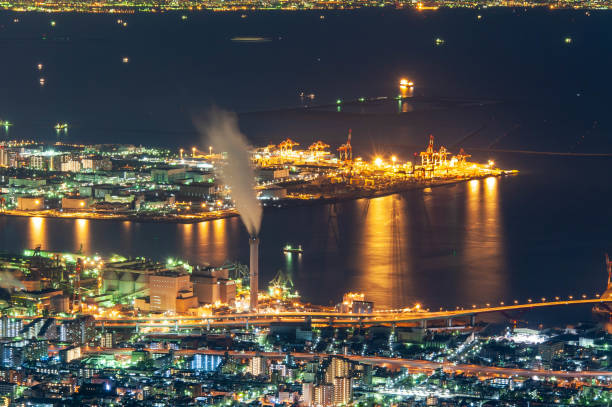 istock Night view of Kobe with a chimney that emits smoke 1171239754