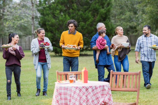 istock Multi-generation Hispanic family having backyard cookout 1171240571