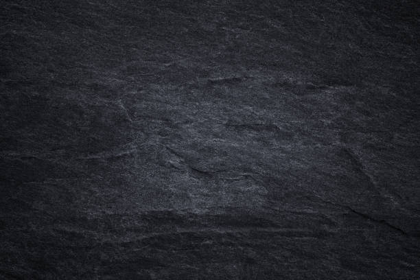 istock Dark grey black slate background or natural black stone texture 1171241391