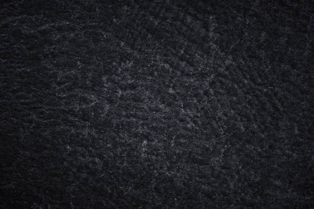 istock Dark grey black slate background or natural black stone texture 1171241403